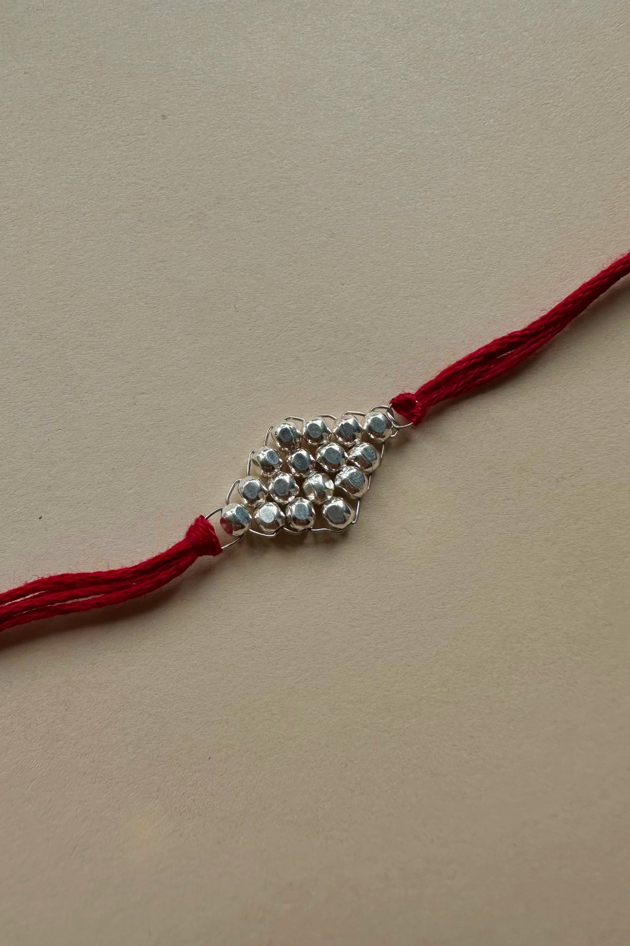 Handmade Pure Silver Rakhi with Fresh Water Pearls