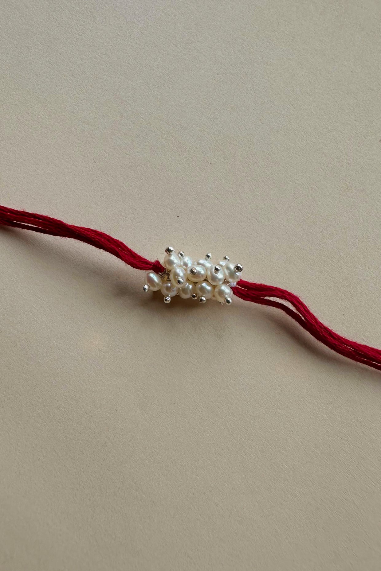 Handmade Pure Silver Rakhi with Fresh Water Pearls