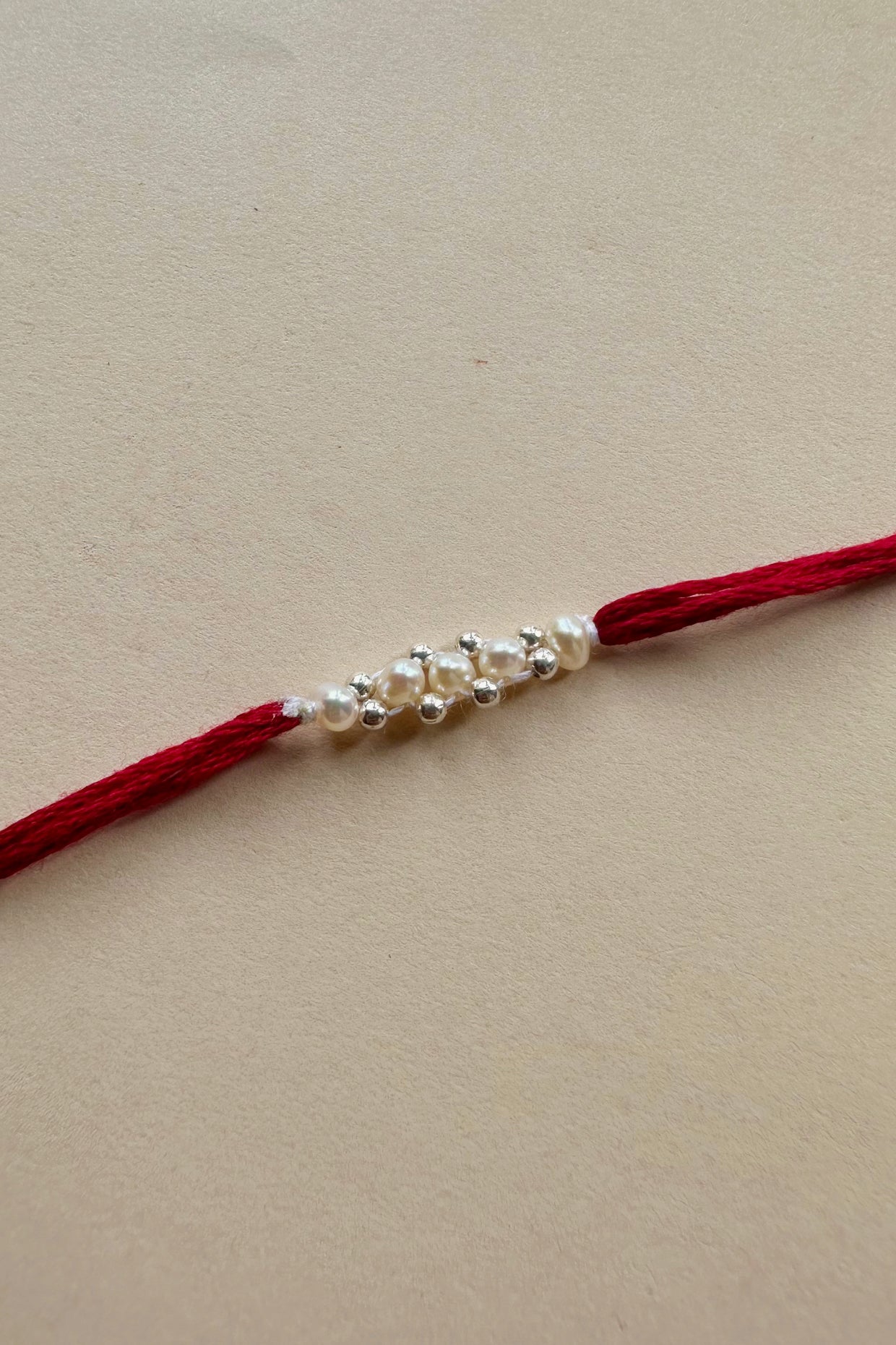 Handmade Pure Silver Rakhi with Fresh Water Pearls